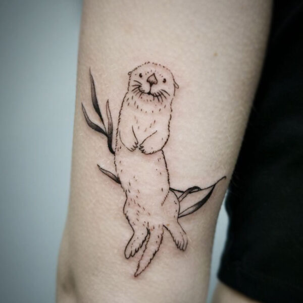 atticus tattoo, fine line tattoo of an otter