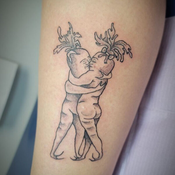 atticus tattoo, black and grey tattoo of two carrots embracing