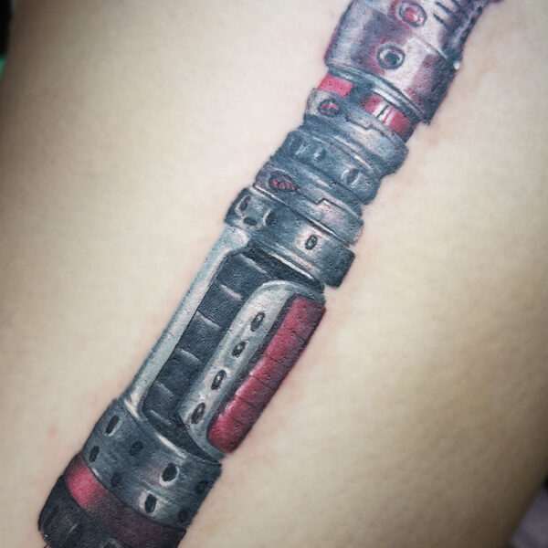 atticus tattoo, coloured, realism tattoo of a lightsaber handle
