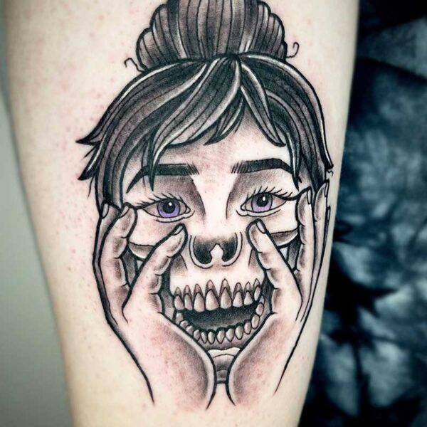 atticus tattoo, black and grey tattoo of a woman whose bottom half of her face is a skull