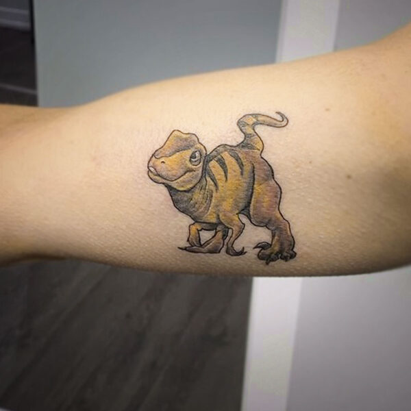 atticus tattoo, tattoo of a yellow, striped t-rex