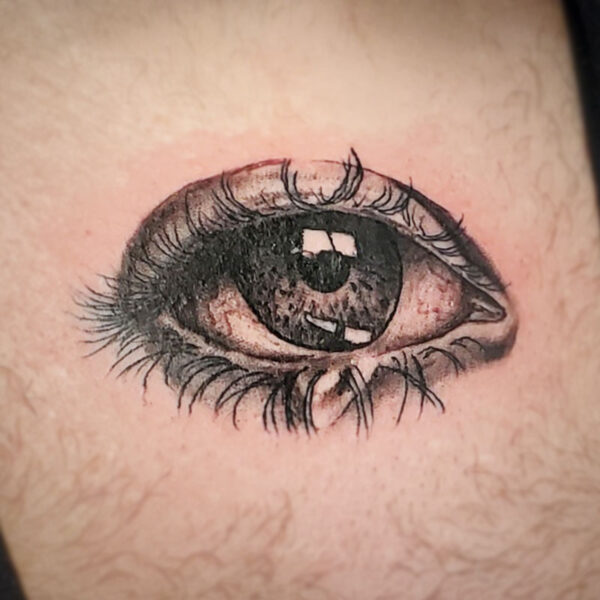 atticus tattoo, black and grey realism tattoo of an eye