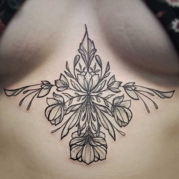 atticus tattoo, black and white tattoo of mirrored flowers