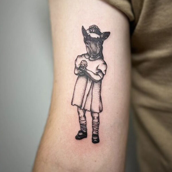 atticus tattoo, black and grey tattoo of a girl with a horsehead wearing a cowboy hat and dress