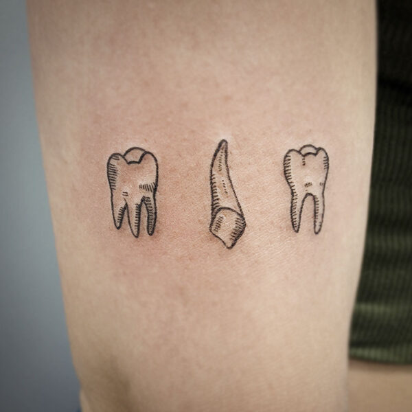 atticus tattoo, line tattoo of three teeth
