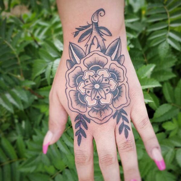 atticus tattoo, black and grey American traditional tattoo of a Mandala rose
