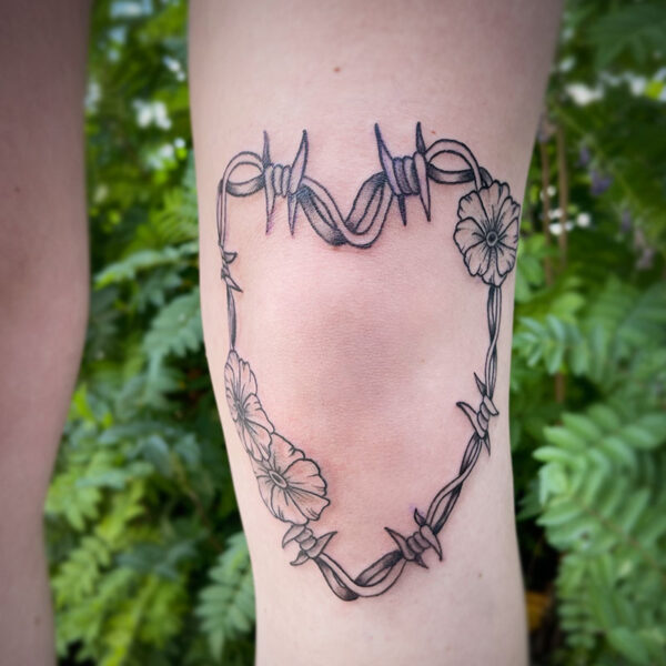 atticus tattoo, black and grey American traditional tattoo of a heart made out of barbed wire