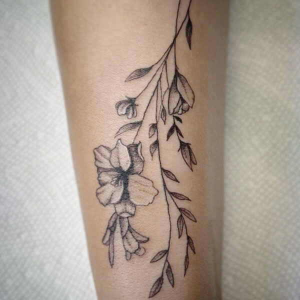atticus tattoo, fine line tattoo of flowers