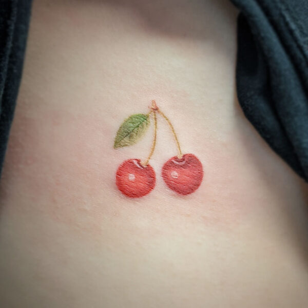 atticus tattoo, coloured tattoo of a pair of cherries