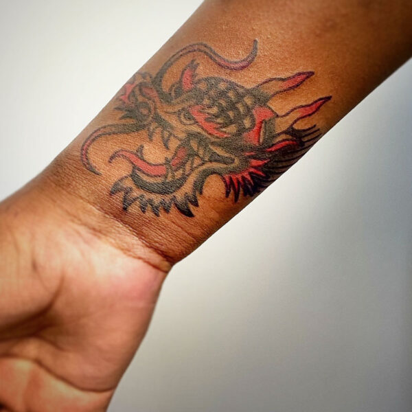 atticus tattoo, traditional tattoo of an Eastern Dragon's head