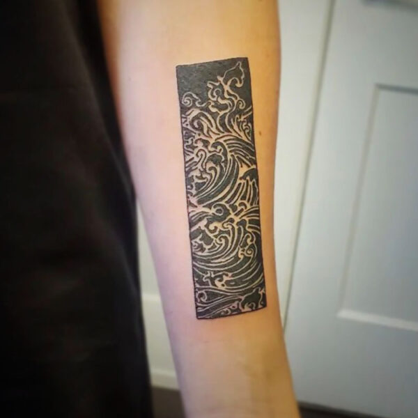 atticus tattoo, black, japanese traditional tattoo of waves in a rectangle