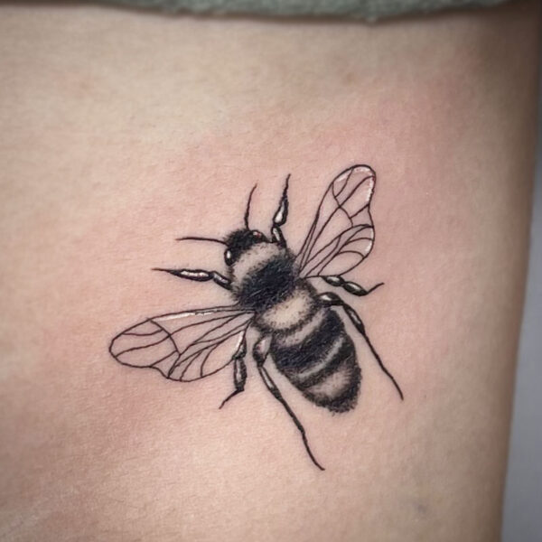 atticus tattoo, black and white tattoo of a bumblebee