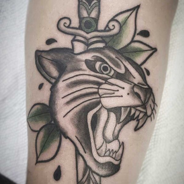 atticus tattoo, american traditional tattoo of a dagger and panther's head