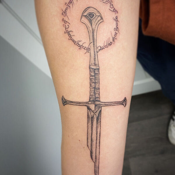 atticus tattoo, black and grey tattoo of the sword Narsil from the Lord of the Rings