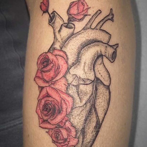 atticus tattoo, black and grey tattoo of a heart with red roses