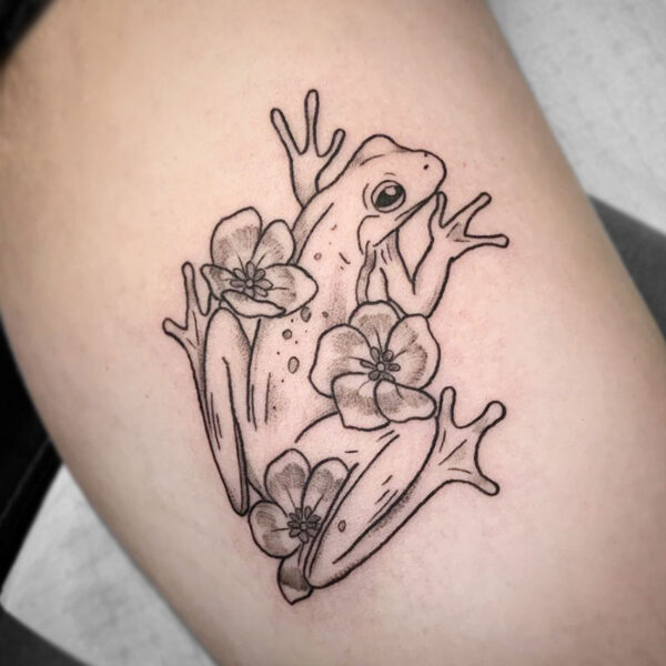 atticus tattoo, black and grey tattoo of a frog with flowers