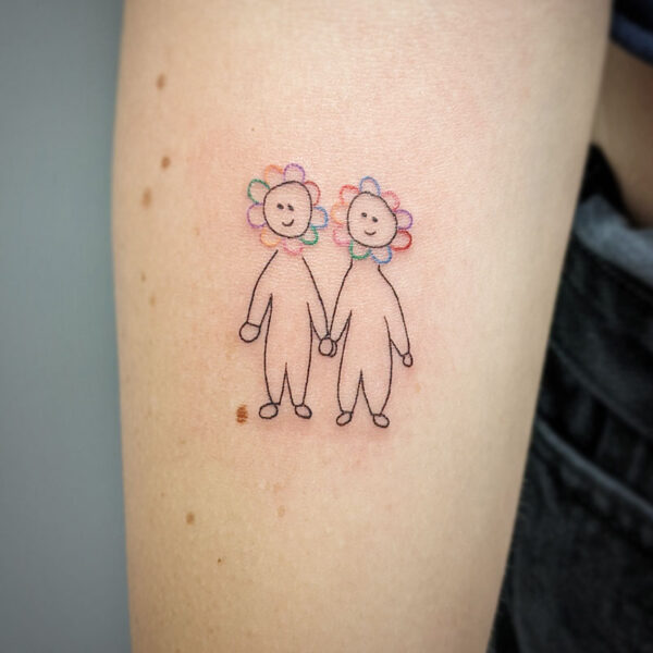 atticus tattoo, fine line tattoo of a pair of cartoon people, with flowers for their heads, holding hands