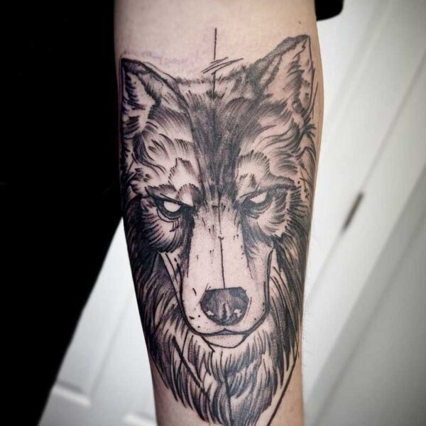 atticus tattoo, black and grey tattoo of a wolf's face