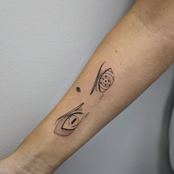 atticus tattoo, anime style tattoo of a character eyes from Naruto