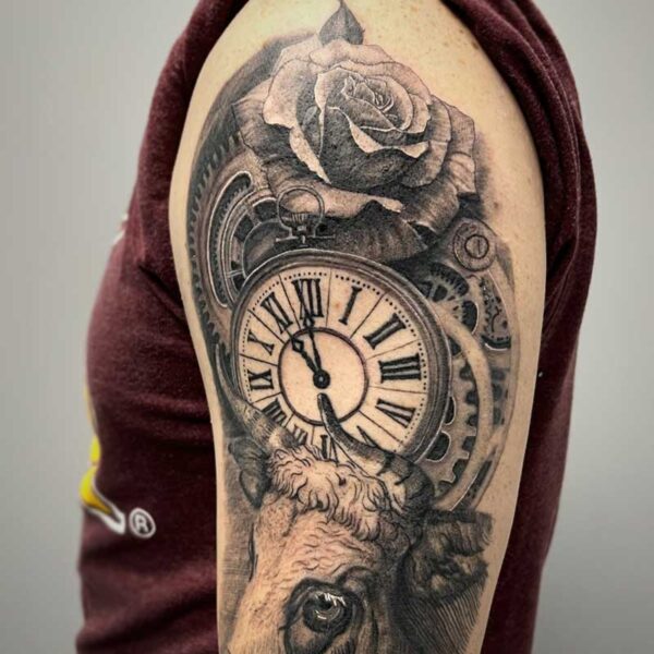 atticus tattoo, black and grey tattoo of a red angus cow with a rose and stopwatch