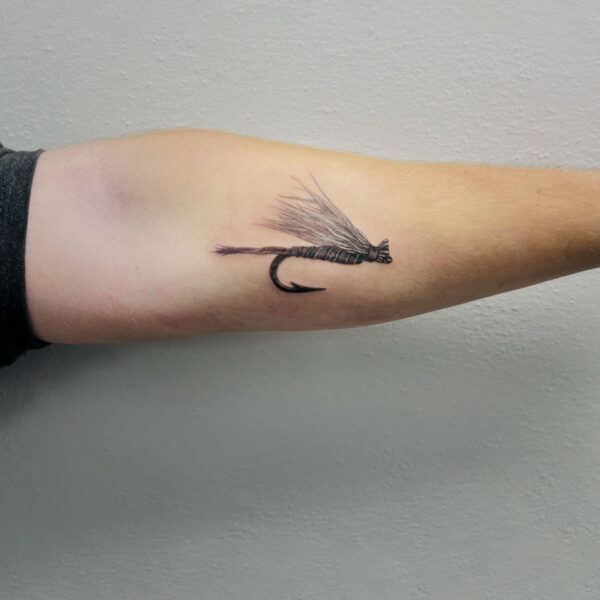 atticus tattoo, black and grey realism tattoo of a fishing fly