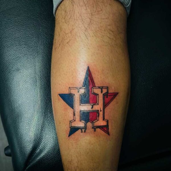 atticus tattoo, tattoo of a red and blue star with the letter "H"