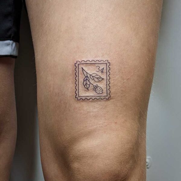 atticus tattoo, fine line tattoo of a stamp