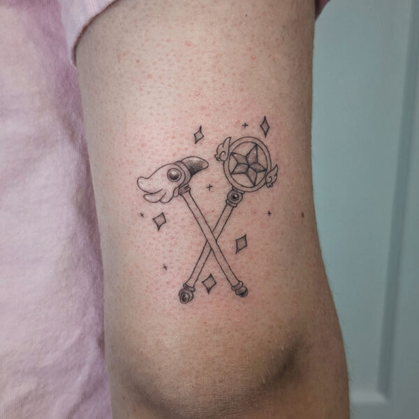 atticus tattoo, anime style tattoo of the wands from Cardcaptors