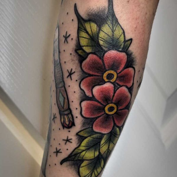 atticus tattoo, coloured neotraditional tattoo of flowers