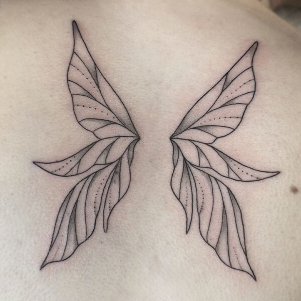 atticus tattoo, fine line tattoo of fairy wings
