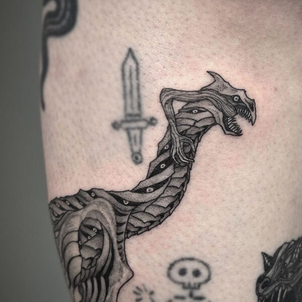 atticus tattoo, black and grey tattoo of the loch ness monster