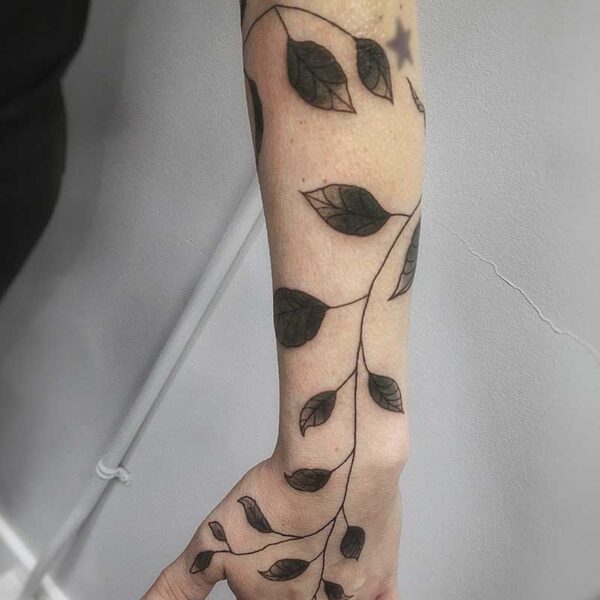 atticus tattoo, black and grey tattoo sleeve of vines and leaves