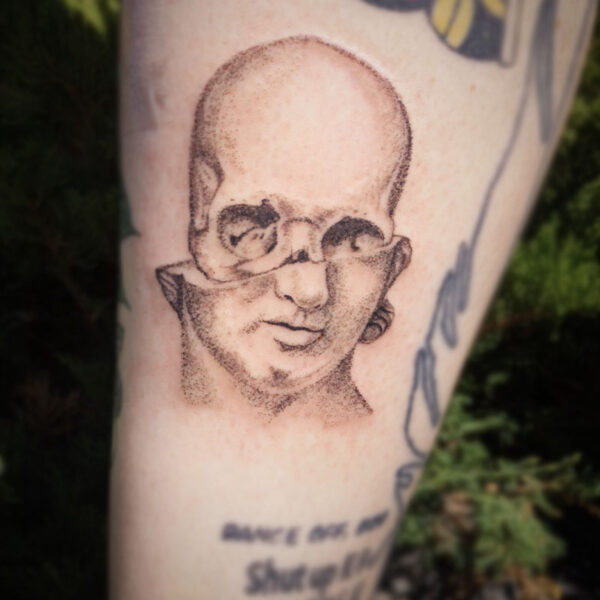 atticus tattoo, dotwork tattoo of a bust with half of its skull showing