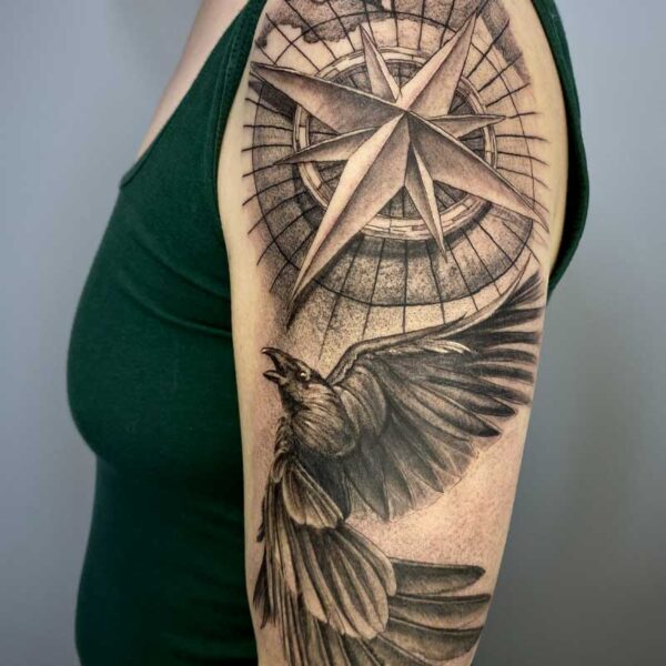 atticus tattoo; realism tattoo of a raven and compass