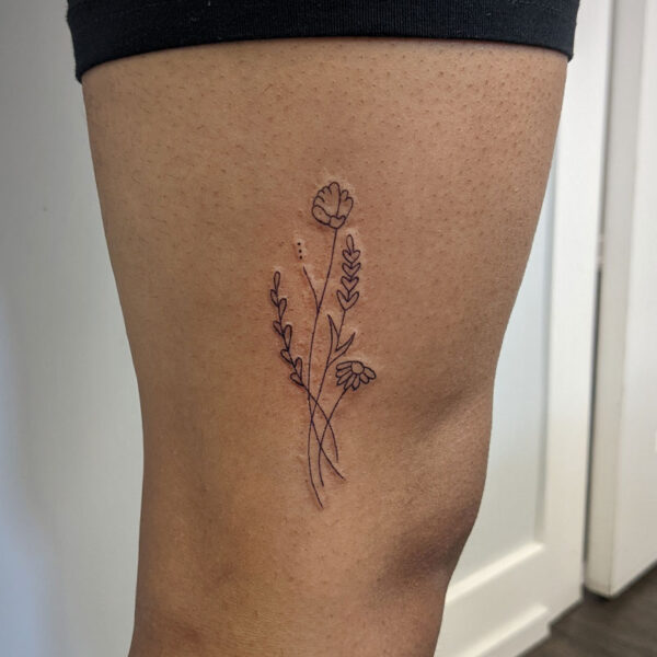 atticus tattoo, fine line tattoo of stems of flowers