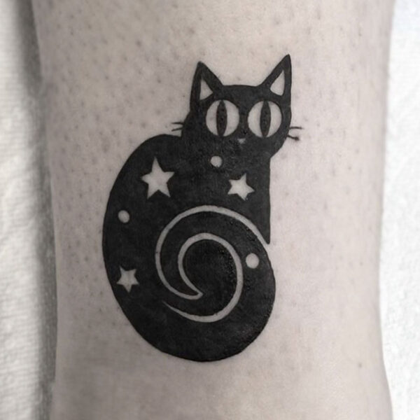 atticus tattoo; tattoo of a black cat with stars in it's body