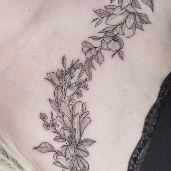 atticus tattoo, fine line tattoo of a vine of various flowers