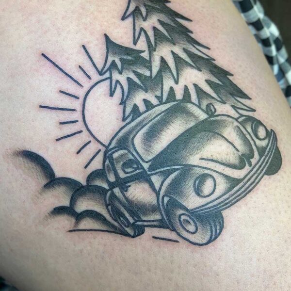 atticus tattoo, black and grey American traditional tattoo of a Volkswagon beetle driving through a forest