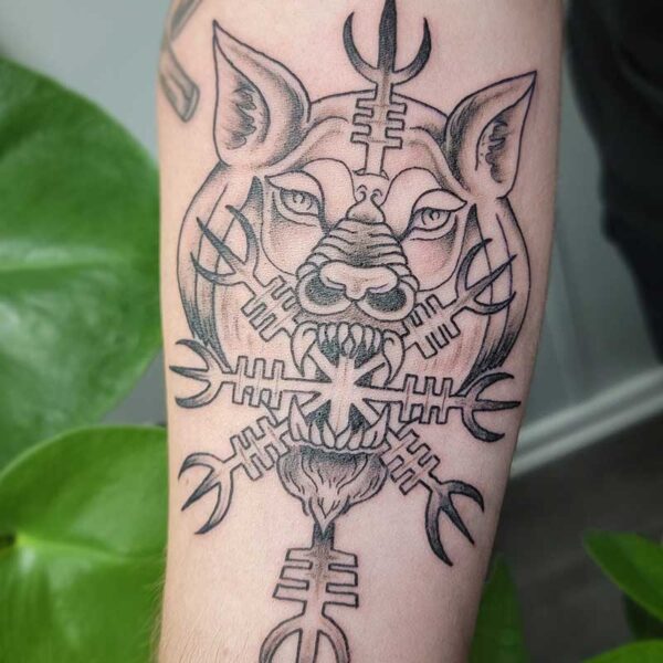 atticus tattoo, black and grey neotraditional tattoo of a wolf head with viking runes