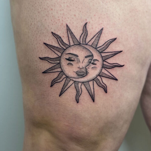 atticus tattoo, black and grey tattoo of the sun and moon kissing