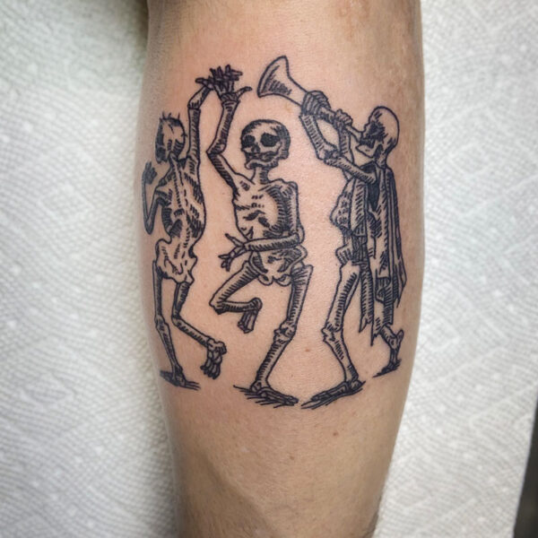 atticus tattoo, black line tattoo of two skeletons dancing and one playing a trumpet