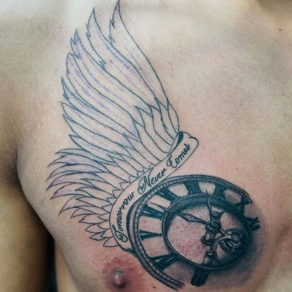 atticus tattoo, black and grey tattoo of a clock with a wing coming out of it