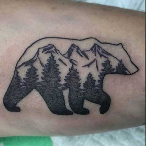 atticus tattoo, black and grey tattoo of a bear with the three sisters in the body