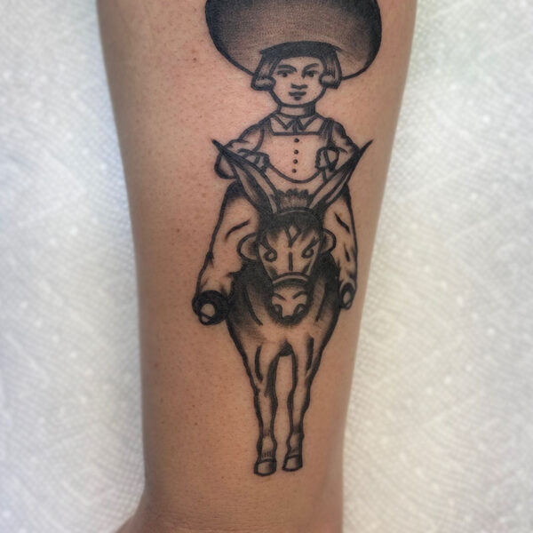 atticus tattoo, american traditional tattoo of a boy wearing a sombrero and riding a donkey