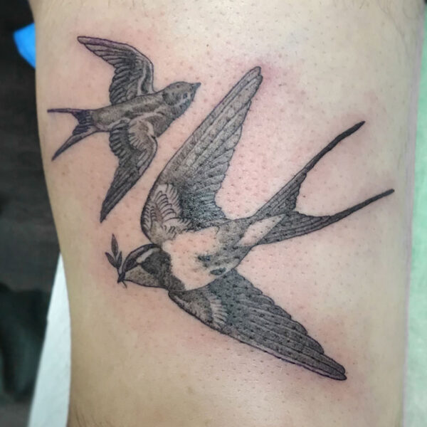 atticus tattoo, black and grey tattoo of two sparrows flying