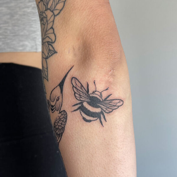 atticus tattoo, black and grey tattoo of a bumblebee