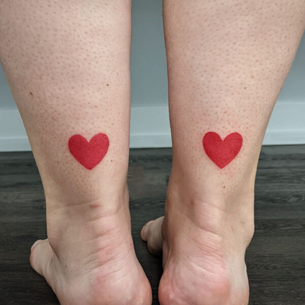 atticus tattoo, tattoo of two red hearts