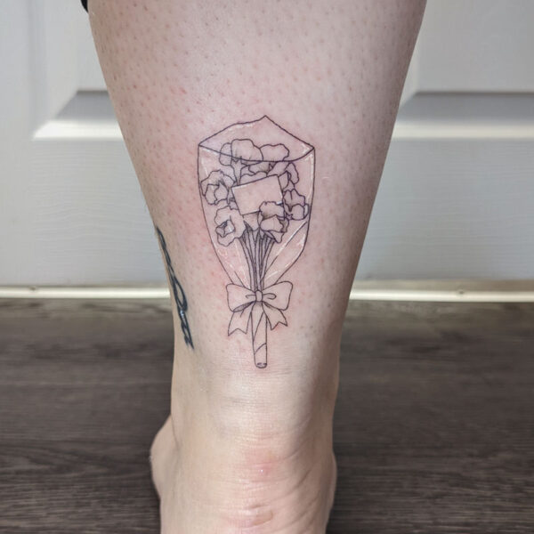 atticus tattoo, fine line tattoo of a bouquet of flowers