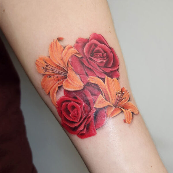 atticus tattoo, realism tattoo of red roses and orange lily's