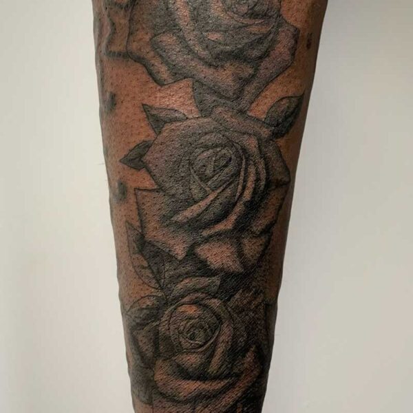 atticus tattoo, black and grey realism tattoo of roses
